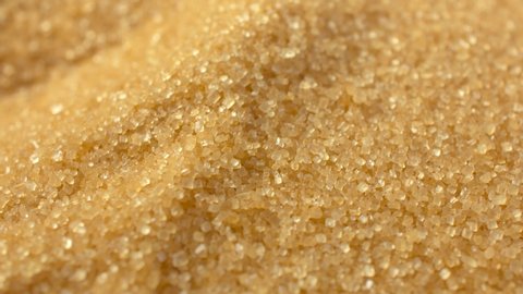 Brown sugar sprinkle on top. Close-up. Cane sugar unrefined, dry demerara. Saccharose