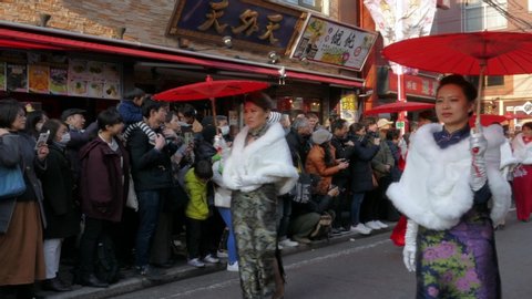 Chinatown , Yokohama / Japan - 02 24 2018: February 24, 2018, Tokyo, Japan - Chinese women wearing cheongsam perform during the Chinese New Year Parade 2018 in Yokohama's Chinatown.