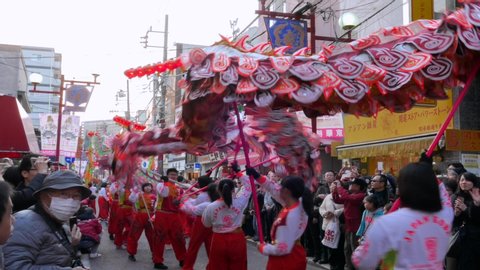 Chinatown , Yokohama / Japan - 02 24 2018: February 24, 2018, Tokyo, Japan - Dragon dance troupe perform during the Chinese New Year Parade 2018 in Yokohama's Chinatown.