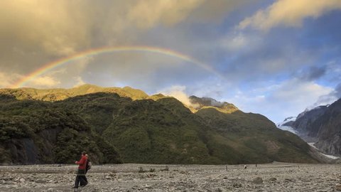 Rainbow over valley of Franz Josef Glacier in Franz Josef, New Zealand. This 12 km long glacier located in Westland Tai Poutini National Park.