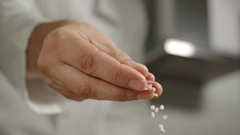 SLOW MOTION: Chef Sprinkles White Coarse Salt While Cooking