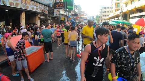 Bangkok, Thailand-April 13, 2019: Locals and tourists celebrate Songkran Festival, Traditional Thai New Year. People play water, and use water guns to enjoy the festival in Khao Sarn Road.