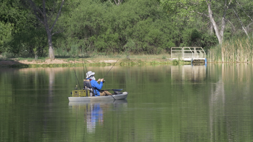 Man bass fishing on a boat in northern Arizona.