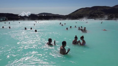 GRINDAVIK, ICELAND - CIRCA 2018 - Establishing of bathers enjoying the famous Blue Lagoon geothermal hot water spa and bath in Grindavik, Iceland.