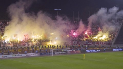 NOVI SAD, SERBIA - CIRCA 2018 - A riot and fires break out as soccer hooligans go crazy rioting at a football match in Novi Sad, Serbia.