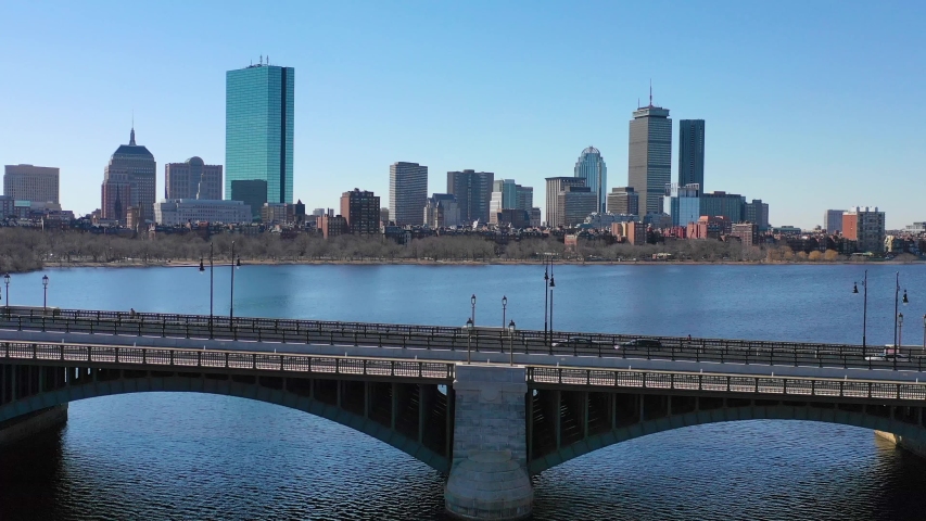 BOSTON, MASSACHUSETTS - CIRCA 2018 - Aerial establishing city skyline of Boston Massachusetts with Longfellow bridge and vehicle traffic crossing.