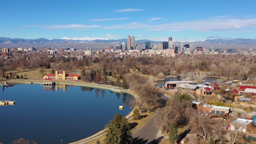 DENVER, COLORADO - CIRCA 2018 - Good aerial of downtown Denver Colorado skyline from large lake at City Park.