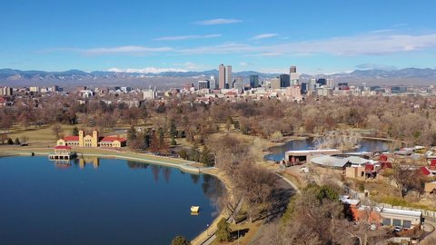 DENVER, COLORADO - CIRCA 2018 - Good aerial of downtown Denver Colorado skyline from large lake at City Park.