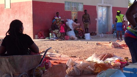 NAMIBIA - CIRCA 2018 - Poor African citizens shop in a basic Africa street market in Opuwo, Namibia.