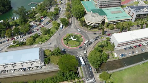 Traffic travels through roundabout in Victoria, Seychelles. Aerial View