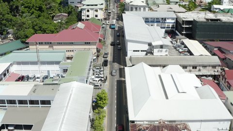 Cars travel down streets of Victoria on Mahe Island, Aerial Seychelles