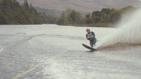 Slalom skier crossing waves in Slow Motion