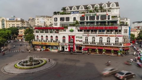 Timelapse of building in Hanoi Famous Roundabout with traffic. High angle of Dong Kinh Nghia Thuc Square in Old Quarter.  HANOI, VIETNAM, JULY 15 2019