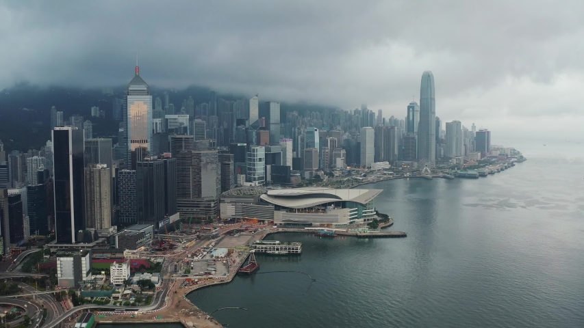 Aerial View drone 4k footage Of Modern Skyscrapers In Hong Kong. buildings in Hong Kong city. Victoria Harbour. Royalty-Free Stock Footage #1035508211