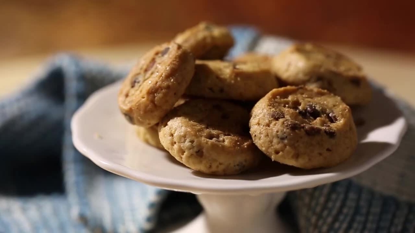 Chip cake cookies with chocolate pieces, close up rotation loopable. Food background. Gastronomy concept. Macro tasty chip cake cookies with chocolate