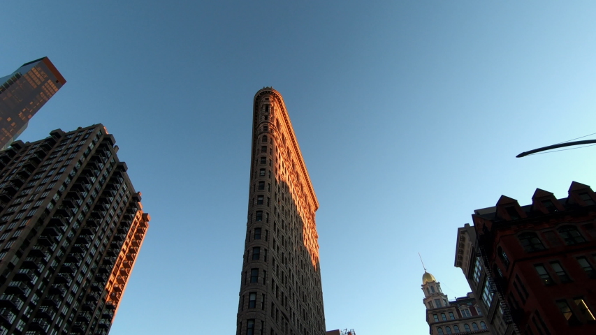 Buildings around and Flat Iron Building, Manhattan, New York City at sunset