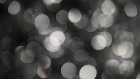 Black and white holiday bokeh video background.
