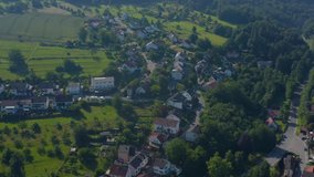 Aerial view of the village Pleutersbach in Germany.  Camera pans left over town.