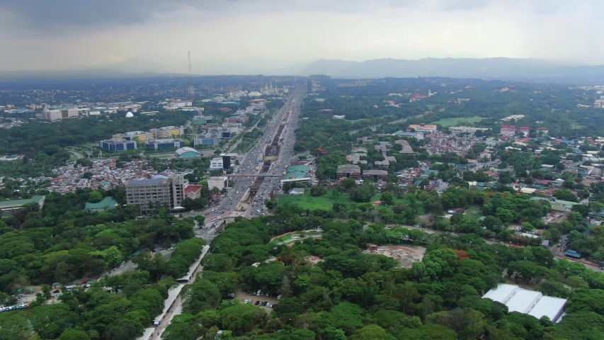 Nice wide overview outlook of the huge City of Quezon City and the mini forest area of Quezon Memorial Circle.