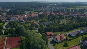 Aerial view of the village Mudau in Germany. Wide view of the town with pan to the right.