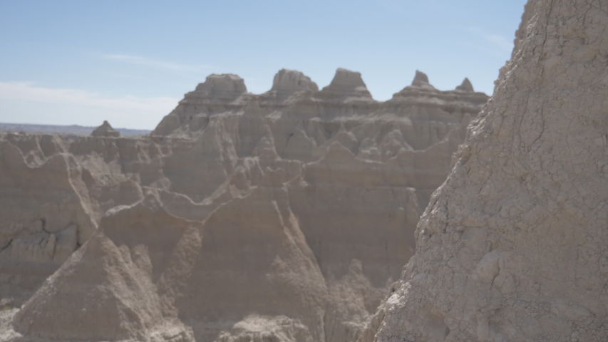 Man taking pictures in the Badlands National Park of South Dakota