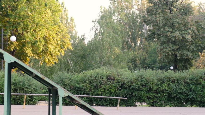 Young guy riding a bmx bike and doing tricks, slow motion