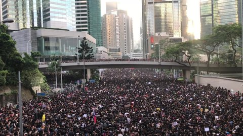 2 million peaceful protesters marching against extradition bill. Chanting 'Add Oil Hong Kong'. Outside Police Headquarters, Hong Kong- 16 June 2019, 6:31pm