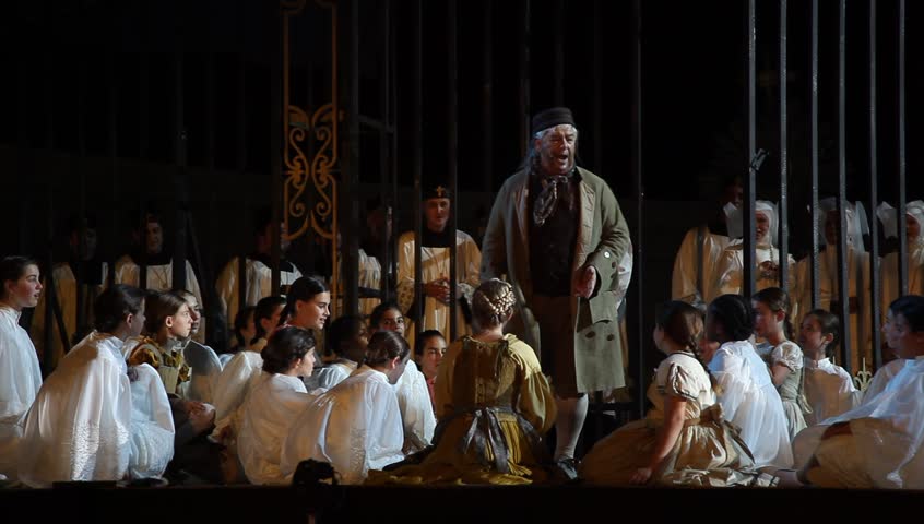 MASADA, ISRAEL - JUNE 01, 2015: Maestro Daniel Oren conducts on Giacomo Puccini’s ‘Tosca’ opera during dress rehearsal. The Festival takes place at the foothills of Masada UNESCO World Heritage site.  | Shutterstock HD Video #10355558