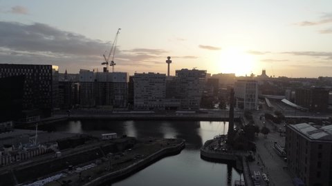 Liverpool shipyard sunrise aerial view above city waterfront iconic dock cityscape skyline.