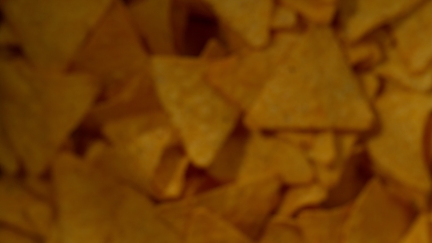 Super slow motion of flying tortilla chips on black background. Filmed on high speed cinema camera, 1000 fps. | Shutterstock HD Video #1035563981