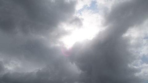 Sun covered by stormy clouds
