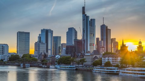 Frankfurt Germany skyline aerial view at sunset in summer in Germany City Frankfurt am main video in 4k. View of skyscrapers and river main in city centre. Time lapse footage.