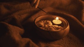 The beginning of the spa ceremony. Candle lighting with stick.  - Powered by Shutterstock - Get 15% off with code: PIKWIZARD15