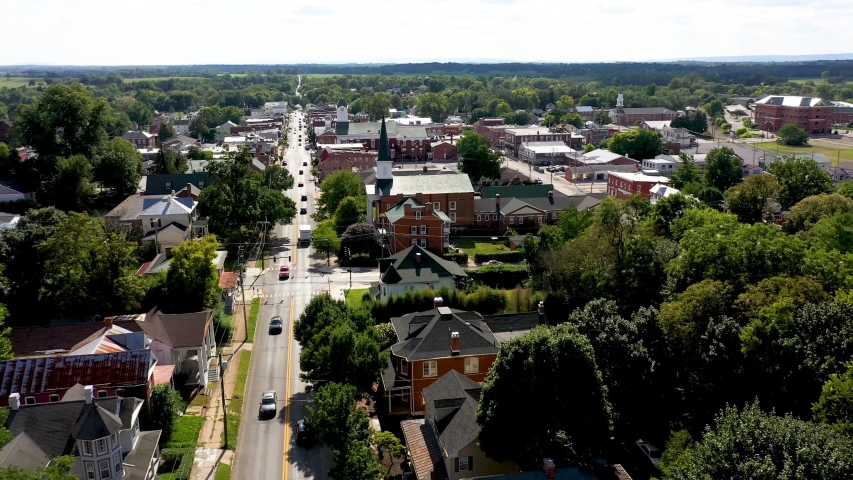 Aerial view backing away from Charles Town, West Virginia over the main street. Royalty-Free Stock Footage #1035584039