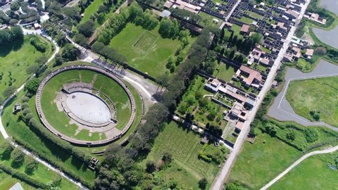 Aerial bird view of Amphitheatre of Pompeii is the oldest surviving Roman amphitheater and is located in the ancient city and was buried by the eruption of Vesuvius in 79 AD 4k high resolution