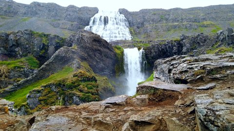 Stunning Dynjandi Waterfall in Iceland's west fjords, push in to lower falls in the rain 4k ProResHQ.