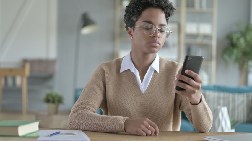 Ambitious African Girl Taking Call on Her phone