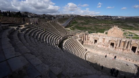 Jerash / Jordan - 01 06 2019: Jerash, Jordan, January 2019 - North Theater of Jerash in Roman Ruins with Rows of Stone Stairs and Tourists Walking All over the Place