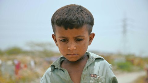 Karachi, Pakistan - July 20th 2019: A street child in a slum of Karachi, Pakistan