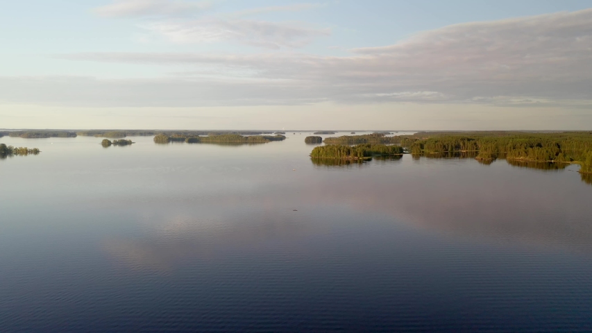 Finnish forest and lakes in Taipalsaari captured with drone on sunny day with some clouds