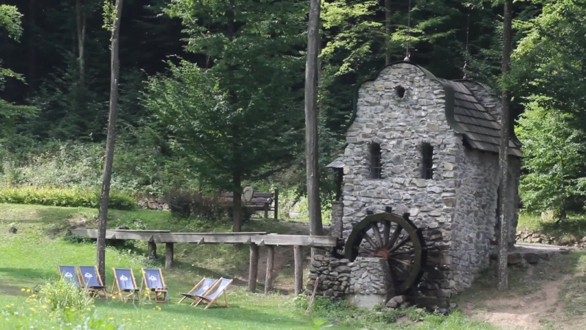 Rotating wheel of the old water mill in the park