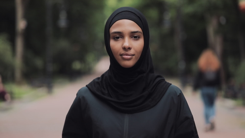 Young Preety Muslin Girl Wearing a Hijabt Running in the Park Concept Healthy Lifestyle Close Up. | Shutterstock HD Video #1035639749