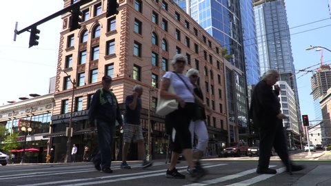 TIME LAPSE OF PEOPLE AND TRAFFIC, SEATTLE, WASHINGTON, USA – 30 JULY 2019 Time lapse of people, cyclists, cars and traffic crossing the junction of Pike Street and Second Avenue, Seattle