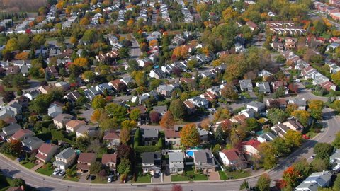 Fall in Montreal, Quebec, Canada, aerial view of beautiful residential neighbourhood showing maple trees changing colour in autumn season. 