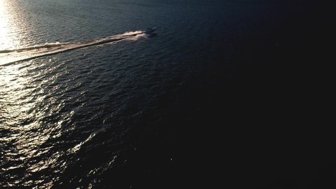 Aerial 4K - Speedboat on Lake Como (IT) at sunset