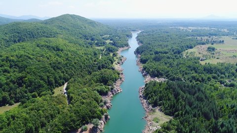 Drone flying over river Lika in Croatia. A beautiful river in the mountain region of Croatia, also called Lika.