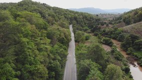 High angle highway with natural forest and fog at north of Thailand