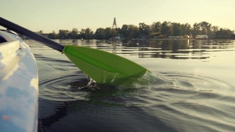 Kayak Oar Paddle Rowing At Sunrise On Vacation Holiday. Paddle Sport Rowing On Quiet River At Sunset.Athlete Swimming On Canoe Sunset Time On Tranquil River. Sports Recreation Training Workout In Boat