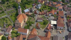 Aerial view of the village Reicholzheim in Germany. Pan to the right from the front of the church.