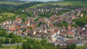 Aerial view of the village Urphar in Germany. Pan to the left around the town.